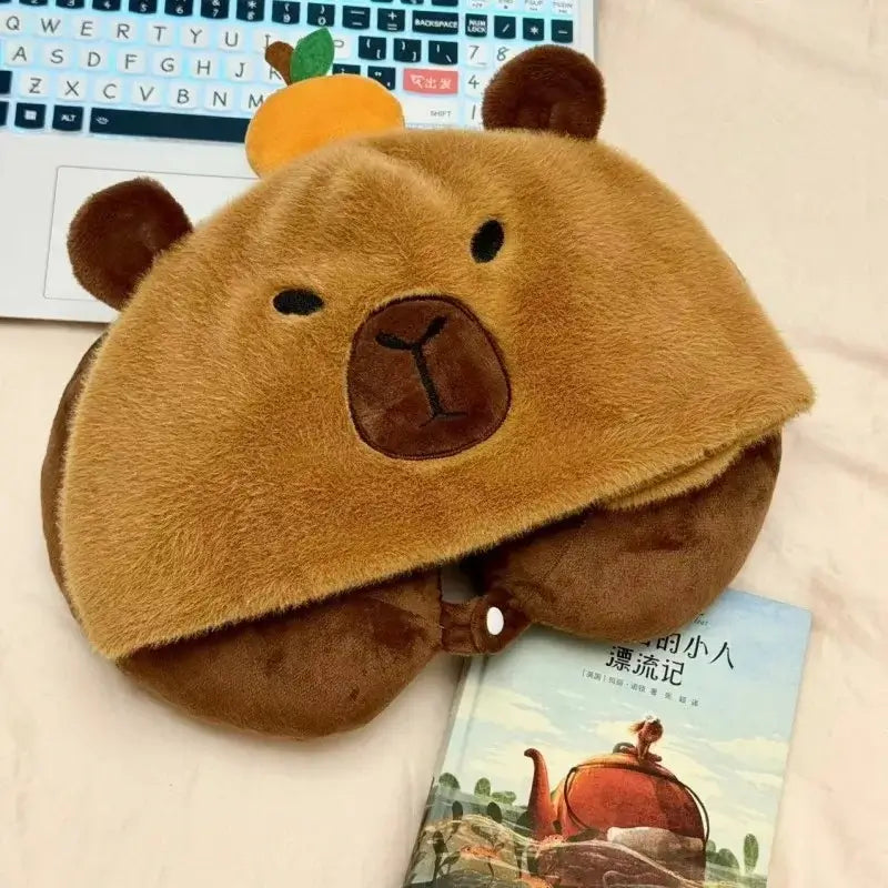 Travel pillow with capybara hood