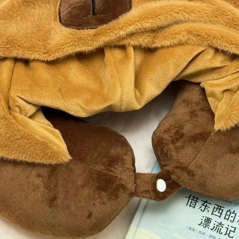 Travel pillow with capybara hood