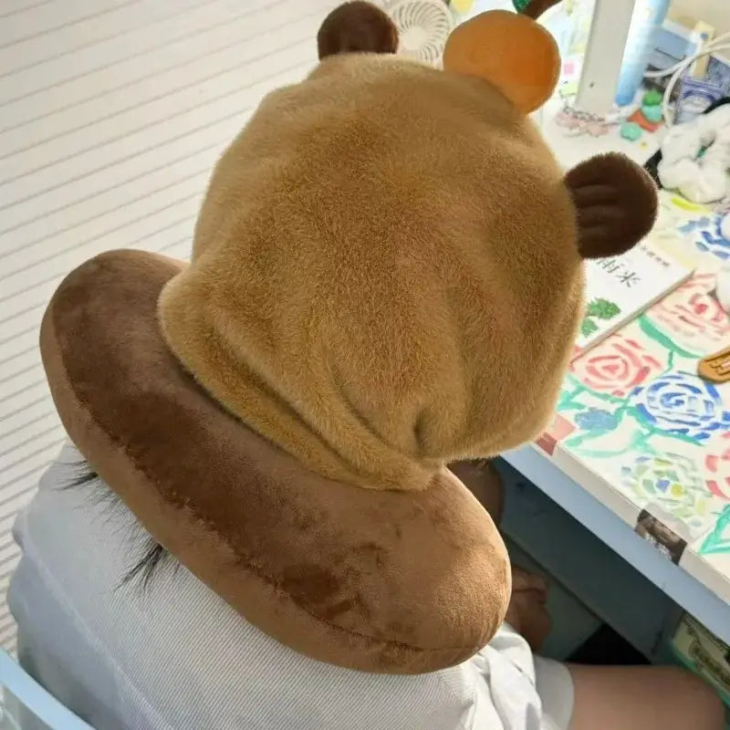 Travel pillow with capybara hood