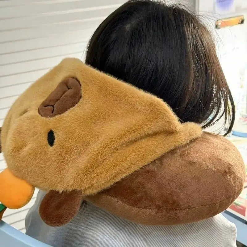 Travel pillow with capybara hood